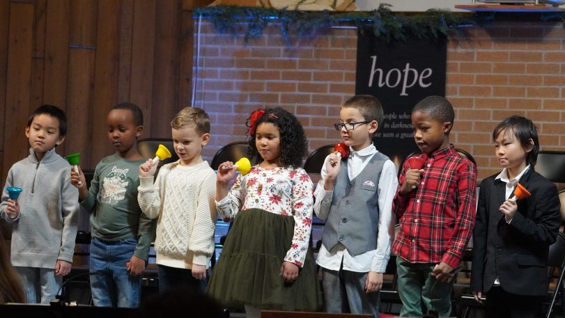 Students in Grades 1 & 2 learning hand bells at a young age.