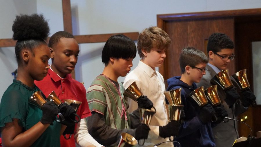Students in grades 7 & 8 perform on the hand bells at our Christmas church service.