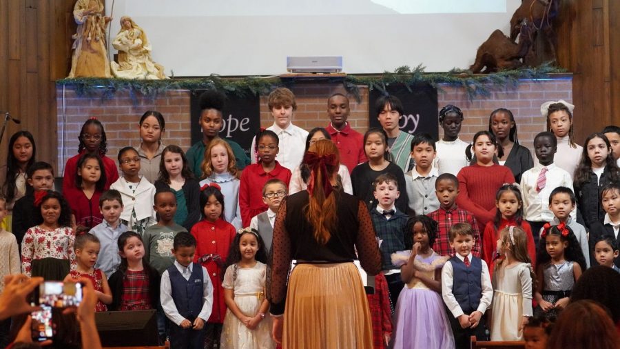 Students perform in an all-school choir piece.